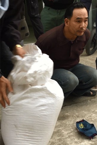 Cất giấu ma túy trong bao tải gạo, phóng xe Cub 82 từ Sơn La về Hà Nội - Ảnh 1.