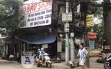 [Ảnh] Cửa hàng mở hé mua bán chui, bất chấp lệnh cấm còn 4 ngày