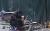 [ẢNH] Người dân Hà Nội co ro trong cái rét đậm nhất mùa