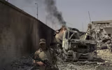 Ám ảnh nữ khủng bố ôm con nhỏ để đánh bom tự sát giết binh sĩ quân đội Iraq