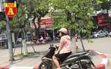 [ẢNH] Đường phố Hà Nội vắng hoe, người dân chống nắng kín mít vẫn ngại ra đường