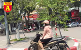 [ẢNH] Đường phố Hà Nội vắng hoe, người dân chống nắng kín mít vẫn ngại ra đường
