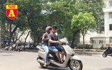 [ẢNH] Đường phố Hà Nội vắng hoe, người dân chống nắng kín mít vẫn ngại ra đường