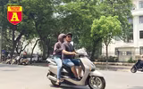 [ẢNH] Đường phố Hà Nội vắng hoe, người dân chống nắng kín mít vẫn ngại ra đường