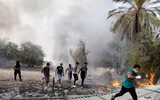 [ẢNH] Iraq tan hoang vì biểu tình biến thành bao động