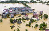 [Ảnh] Chưa hết đợt dịch Covid-19 thứ hai, Trung Quốc lại ứng phó với lũ lụt lịch sử