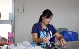[ẢNH] Ngàn người chầu chực dưới mưa chờ mua vé trận Việt Nam - Malaysia