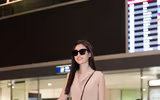 Trở về từ Miss World, Mỹ Linh đeo kính đen che mắt thâm quầng