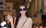 Trở về từ Miss World, Mỹ Linh đeo kính đen che mắt thâm quầng