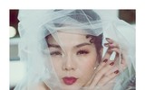 Lệ Quyên bất ngờ mặc váy cưới sau 7 năm kết hôn