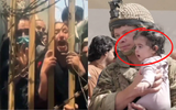 [ẢNH] Số phận mỉm cười với em bé Aghanistan sơ sinh di tản qua hàng rào kẽm gai