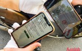 [ẢNH] Kiểm tra mã QR ở chốt ra vào vùng đỏ Hà Nội: Không ùn tắc, giấy đi đường cũ được lưu thông