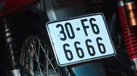 Có được bấm biển số xe mới khi đã có biển số định danh?