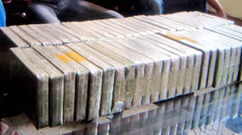 Xét xử 13 bị cáo trong đường dây vận chuyển 223 bánh heroin