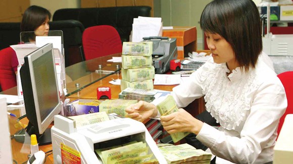 Nhiều ngân hàng thu lãi lớn ảnh 1