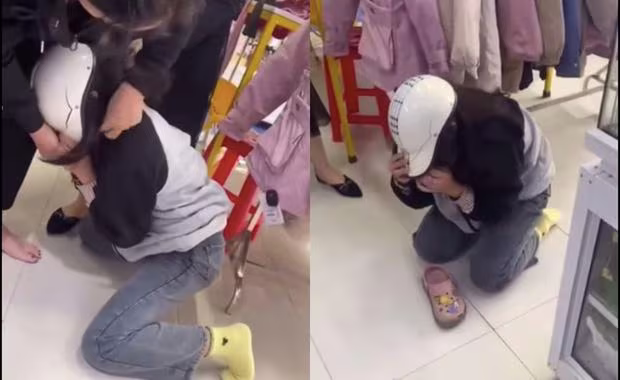 Hình ảnh cô gái quỳ xuống khóc lóc van xin cắt từ clip