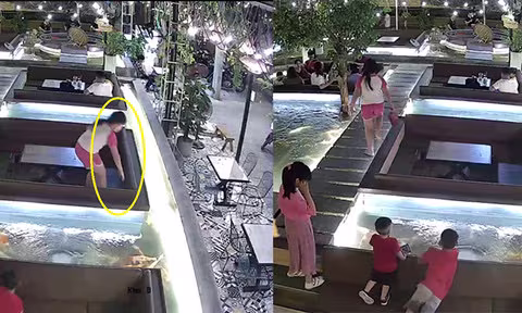 Hình ảnh bé gái sang nhặt ví mang về bàn ngồi chung với người đàn ông Hình ảnh bé gái sang nhặt ví mang về bàn ngồi chung với người đàn ông